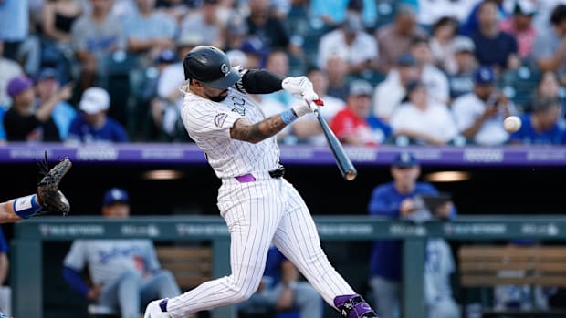 Warming Bernabel hitting for the Colorado Rockies wearing all white uniforms. 