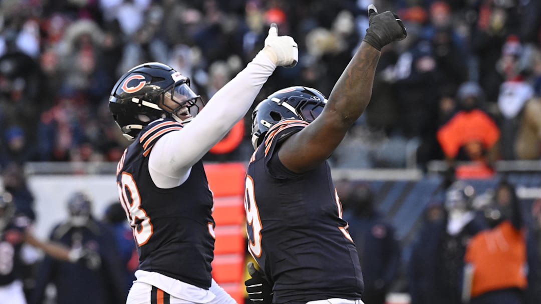 Dec 14, 2025; Chicago, Illinois, USA; Chicago Bears defensive end Montez Sweat (98) and Chicago Bears defensive tackle Gervon Dexter Sr. (99) celebrate after a sack of Cleveland Browns quarterback Shedeur Sanders (12) during the fourth quarter at Soldier Field. Mandatory Credit: Matt Marton-Imagn Images