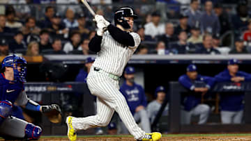 Oct 30, 2024; New York, New York, USA; New York Yankees outfielder Alex Verdugo (24) hits a RBI single during the second inning against the Los Angeles Dodgers in game five of the 2024 MLB World Series at Yankee Stadium. Mandatory Credit: Vincent Carchietta-Imagn Images
