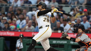 Jul 22, 2025; Pittsburgh, Pennsylvania, USA;  Pittsburgh Pirates left fielder Tommy Pham (28) hits an RBI double against the Detroit Tigers during the sixth inning at PNC Park. Mandatory Credit: Charles LeClaire-Imagn Images