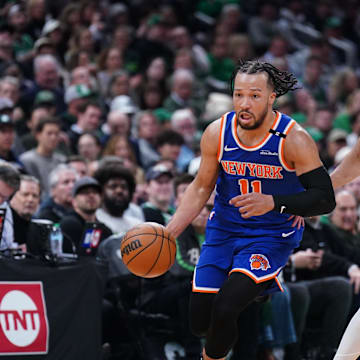 May 5, 2025; Boston, Massachusetts, USA; New York Knicks guard Jalen Brunson (11) returns the ball against Boston Celtics guard Derrick White (9) in the second quarter during game one of the second round for the 2025 NBA Playoffs at TD Garden. Mandatory Credit: David Butler II-Imagn Images