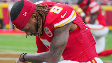 Aug 22, 2025; Kansas City, Missouri, USA; Kansas City Chiefs cornerback Kristian Fulton (8) kneels on the field prior to a game at GEHA Field at Arrowhead Stadium.
