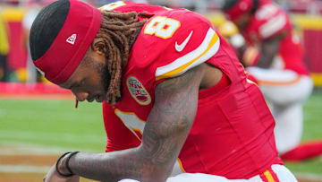 Aug 22, 2025; Kansas City, Missouri, USA; Kansas City Chiefs cornerback Kristian Fulton (8) kneels on the field prior to a game at GEHA Field at Arrowhead Stadium.