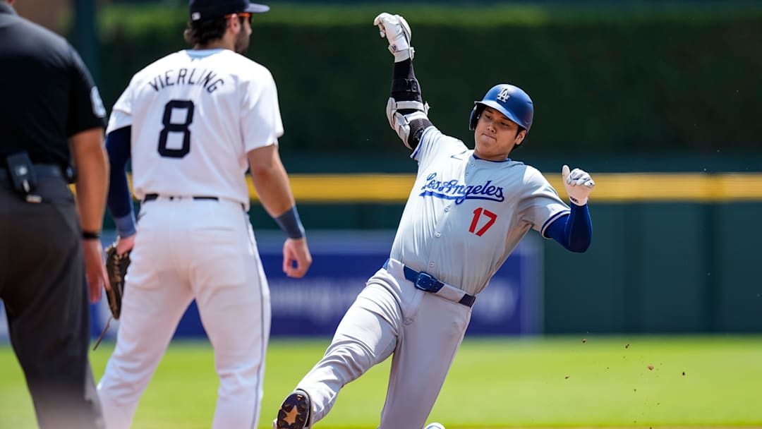 L. A. Dodgers designated hitter Shohei Ohtani (17) slides into third base against Detroit Tigers third base Matt Vierling (8) during the first inning at Comerica Park in Detroit on Saturday, July 13, 2024.