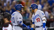 Sep 13, 2022; Phoenix, Arizona, USA; Los Angeles Dodgers infielder Max Muncy (left) celebrates with teammate Justin Turner after hitting a solo home run in the seventh inning against the Arizona Diamondbacks at Chase Field. Mandatory Credit: Mark J. Rebilas-Imagn Images