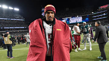 Jan 26, 2025; Philadelphia, PA, USA; Washington Commanders quarterback Jayden Daniels (5) walks off the field after losing the NFC Championship game against the Philadelphia Eagles at Lincoln Financial Field. Mandatory Credit: Eric Hartline-Imagn Images