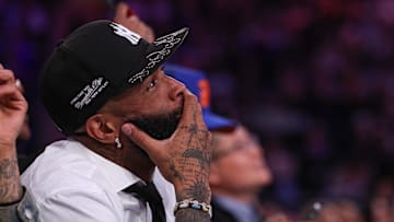 NFL wide receiver Odell Beckham Jr. sits courtside during the second half of the NBA game between the New York Knicks and the Phoenix Suns at Madison Square Garden.