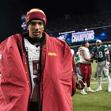 Jan 26, 2025; Philadelphia, PA, USA; Washington Commanders quarterback Jayden Daniels (5) walks off the field after losing the NFC Championship game against the Philadelphia Eagles at Lincoln Financial Field. Mandatory Credit: Eric Hartline-Imagn Images