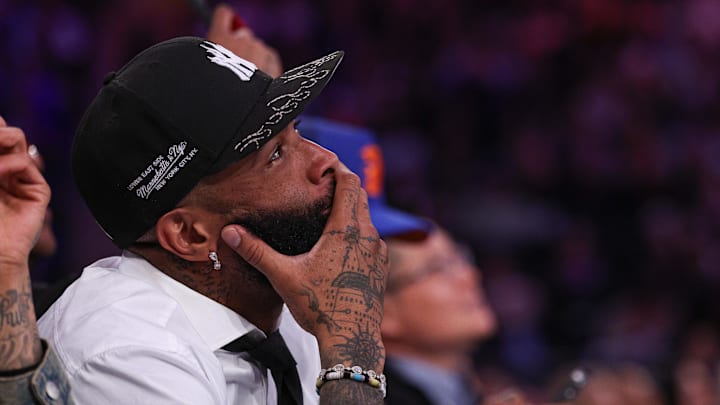 NFL wide receiver Odell Beckham Jr. sits courtside during the second half of the NBA game between the New York Knicks and the Phoenix Suns at Madison Square Garden.