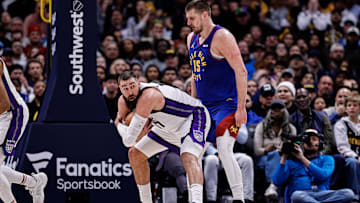 Mar 5, 2025; Denver, Colorado, USA; Sacramento Kings center Jonas Valanciunas (17) covers the ball against Denver Nuggets center Nikola Jokic (15) in the fourth quarter at Ball Arena. Mandatory Credit: Isaiah J. Downing-Imagn Images
