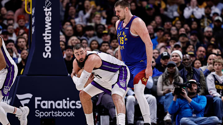 Mar 5, 2025; Denver, Colorado, USA; Sacramento Kings center Jonas Valanciunas (17) covers the ball against Denver Nuggets center Nikola Jokic (15) in the fourth quarter at Ball Arena. Mandatory Credit: Isaiah J. Downing-Imagn Images