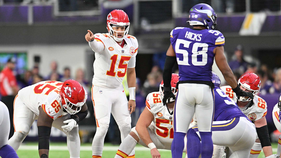 Oct 8, 2023; Minneapolis, Minnesota, USA; Kansas City Chiefs quarterback Patrick Mahomes (15) directs the offense as guard Trey Smith (65) and center Creed Humphrey (52) and Minnesota Vikings linebacker Jordan Hicks (58) look on during the fourth quarter at U.S. Bank Stadium. Mandatory Credit: Jeffrey Becker-Imagn Images