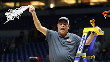 Houston head coach Kelvin Sampson cutting down the nets after defeating Tennessee in the 2025 Elite Eight. 