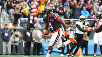 Oct 19, 2025; Chicago, Illinois, USA; Chicago Bears running back D'Andre Swift (4) rushes the ball for a touchdown against the New Orleans Saints during the second quarter at Soldier Field. Mandatory Credit: Mike Dinovo-Imagn Images