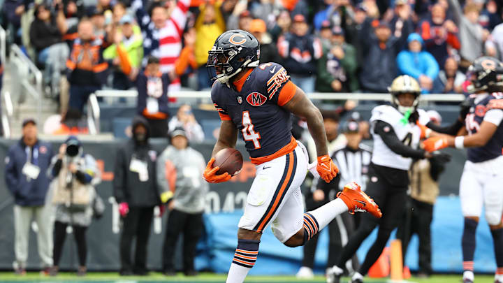Oct 19, 2025; Chicago, Illinois, USA; Chicago Bears running back D'Andre Swift (4) rushes the ball for a touchdown against the New Orleans Saints during the second quarter at Soldier Field. Mandatory Credit: Mike Dinovo-Imagn Images