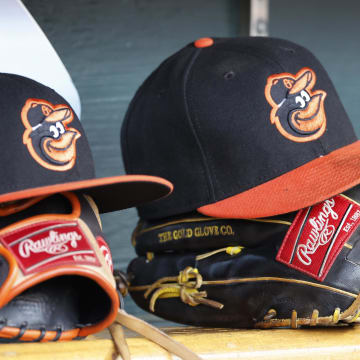 Apr 27, 2023; Detroit, Michigan, USA;  Baltimore Orioles hats and glove sits in dugout in the second inning against the Detroit Tigers at Comerica Park.