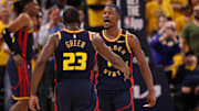 Golden State Warriors forward Draymond Green celebrates with forward Jimmy Butler III after a play against the Houston Rockets.