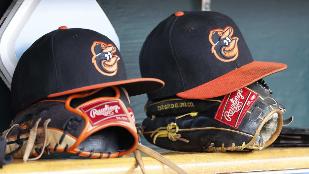 Apr 27, 2023; Detroit, Michigan, USA;  Baltimore Orioles hats and glove sits in dugout in the second inning against the Detroit Tigers at Comerica Park.