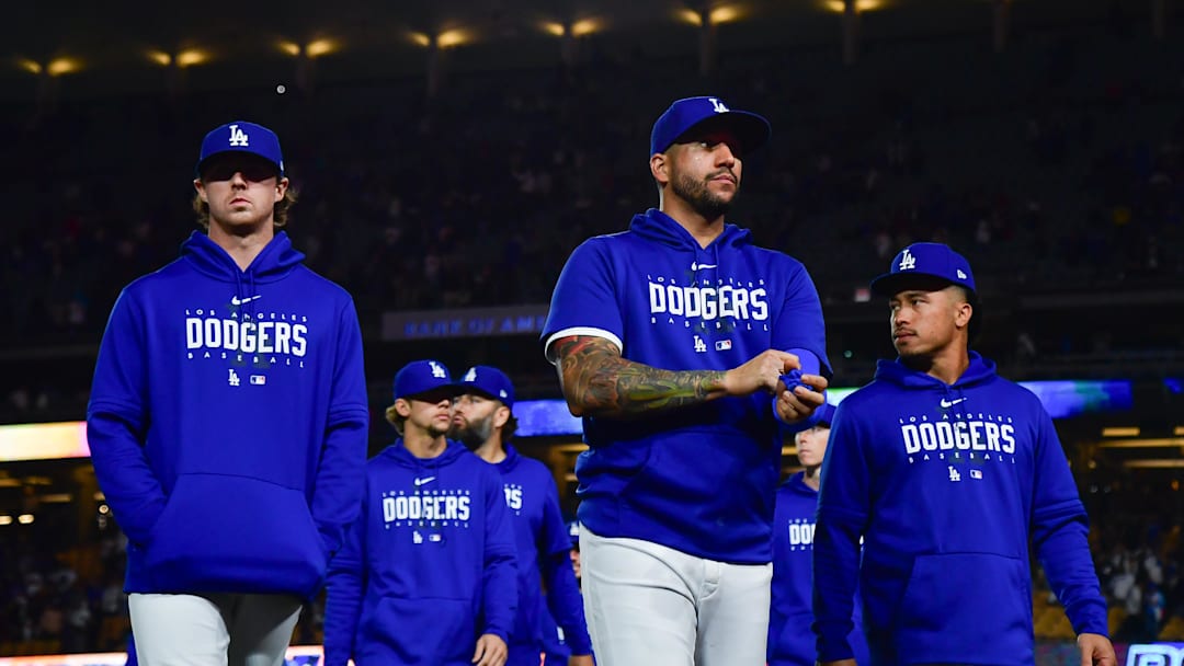 Dodgers left fielder David Peralta (6) second baseman Kolten Wong (25) following the victory against the San Francisco Giants at Dodger Stadium. Dodgers left fielder David Peralta (6) second baseman Kolten Wong (25) following the victory against the San Francisco Giants at Dodger Stadium.