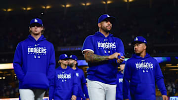 Dodgers left fielder David Peralta (6) second baseman Kolten Wong (25) following the victory against the San Francisco Giants at Dodger Stadium. 
