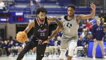 Jan 24, 2024; Houston, Texas, USA; Rice Owls guard Noah Shelby (1) defends against Florida Atlantic Owls guard Jalen Gaffney (12) during the second half at Tudor Fieldhouse. Mandatory Credit: Troy Taormina-Imagn Images