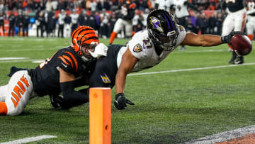 Baltimore Ravens running back J.K. Dobbins (27) breaks a tackle 