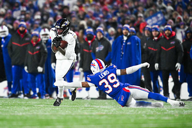 Baltimore Ravens wide receiver Rashod Bateman makes a catch against Buffalo Bills cornerback Cam Lewis 