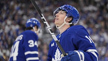 May 18, 2025; Toronto, Ontario, CAN; Toronto Maple Leafs forward Mitch Marner ( looks up at the scoreboard as Toronto Maple Leafs forward Auston Matthews  skates to the bench during the third period of game seven of the second round of the 2025 Stanley Cup Playoffs against the Florida Panthers at Scotiabank Arena. 