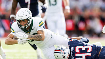 Nov 22, 2025; Tucson, Arizona, USA; Baylor Bears wide receiver Jadon Porter (83) is tackled by Arizona Wildcats defensive back Dalton Johnson (43) in the second half at Casino Del Sol Stadium. Mandatory Credit: Mark J. Rebilas-Imagn Images