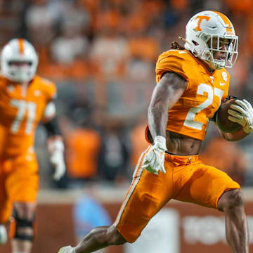 Tennessee running back Peyton Lewis (27) runs with the ball during a NCAA game between Tennessee and Kent State in Neyland Stadium in Knoxville on Saturday, Sept. 14, 2024.