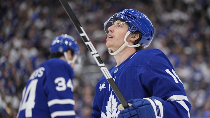 May 18, 2025; Toronto, Ontario, CAN; Toronto Maple Leafs forward Mitch Marner (16) looks up at the scoreboard as Toronto Maple Leafs forward Auston Matthews (34) skates to the bench during the third period of game seven of the second round of the 2025 Stanley Cup Playoffs against the Florida Panthers at Scotiabank Arena. Mandatory Credit: John E. Sokolowski-Imagn Images