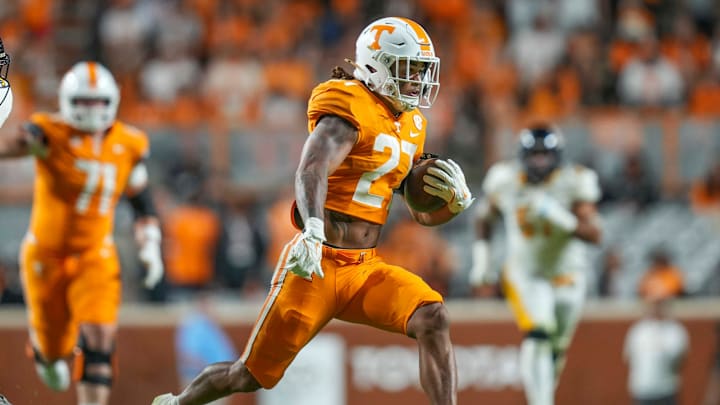 Tennessee running back Peyton Lewis (27) runs with the ball during a NCAA game between Tennessee and Kent State in Neyland Stadium in Knoxville on Saturday, Sept. 14, 2024.