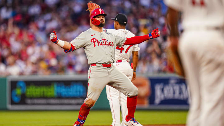 Jun 13, 2024; Boston, Massachusetts, USA; Philadelphia Phillies designated hitter Kyle Schwarber (12) reacts after hitting a double to drive in three runs against the Boston Red Sox in the fourth inning at Fenway Park. 