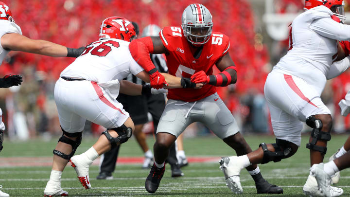 Sep 9, 2023; Columbus, Ohio, USA;  Ohio State Buckeyes defensive tackle Michael Hall Jr. (51) gets past the block of Youngstown State Penguins offensive lineman Aidan Parker (56) during the first half at Ohio Stadium.