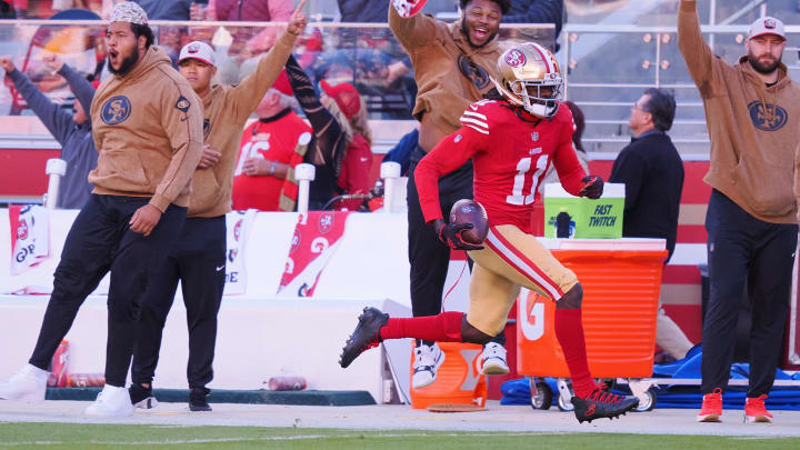 Nov 19, 2023; Santa Clara, California, USA; San Francisco 49ers wide receiver Brandon Aiyuk (11) runs after a catch for a 76-yard touchdown against the Tampa Bay Buccaneers during the third quarter at Levi's Stadium. Mandatory Credit: Kelley L Cox-USA TODAY Sports