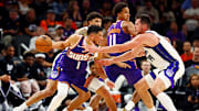 Oct 22, 2025; Phoenix, Arizona, USA; Phoenix Suns guard Devin Booker (1) handles the ball against Sacramento Kings forward Drew Eubanks (19) during the second half at the Mortgage Matchup Center. Mandatory Credit: Mark J. Rebilas-Imagn Images