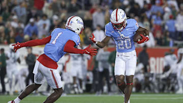 Nov 23, 2024; Houston, Texas, USA; Houston Cougars defensive back Jeremiah Wilson (20) celebrates with defensive back Latrell McCutchin Sr. (1) after an interception during the first quarter against the Baylor Bears at TDECU Stadium. Mandatory Credit: Troy Taormina-Imagn Images