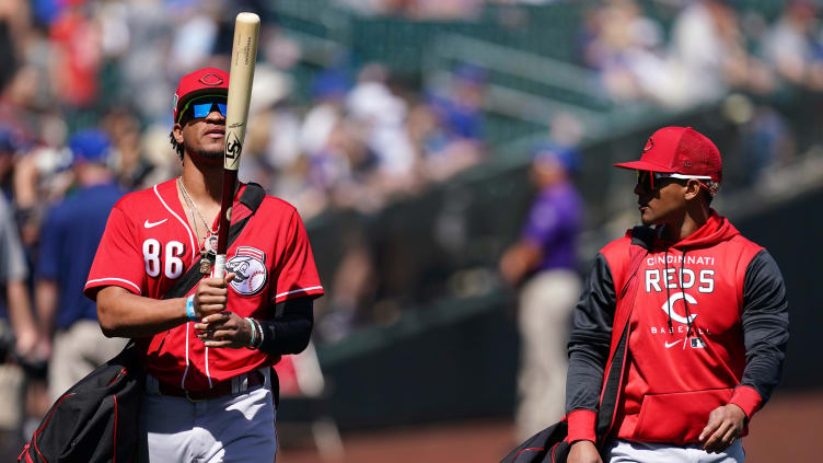 Cincinnati Reds outfielder Allan Cerda (86), left, Cincinnati Reds outfielder Lorenzo Cedrola (83) walk on the field.