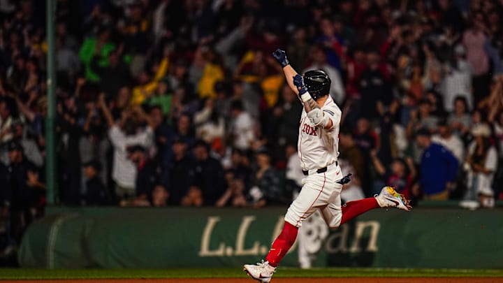 Sep 11, 2024; Boston, Massachusetts, USA; Boston Red Sox left fielder Tyler O'Neill (17) his a three run home run to win the game against the Baltimore Orioles in ten innings at Fenway Park. Mandatory Credit: David Butler II-Imagn Images