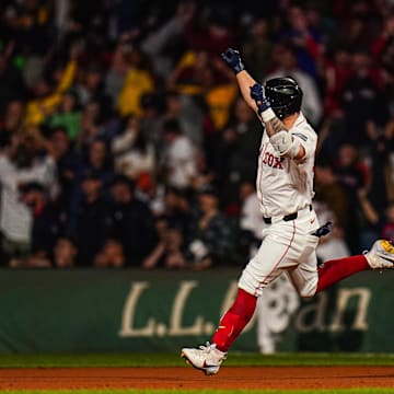 Sep 11, 2024; Boston, Massachusetts, USA; Boston Red Sox left fielder Tyler O'Neill (17) his a three run home run to win the game against the Baltimore Orioles in 10 innings at Fenway Park.