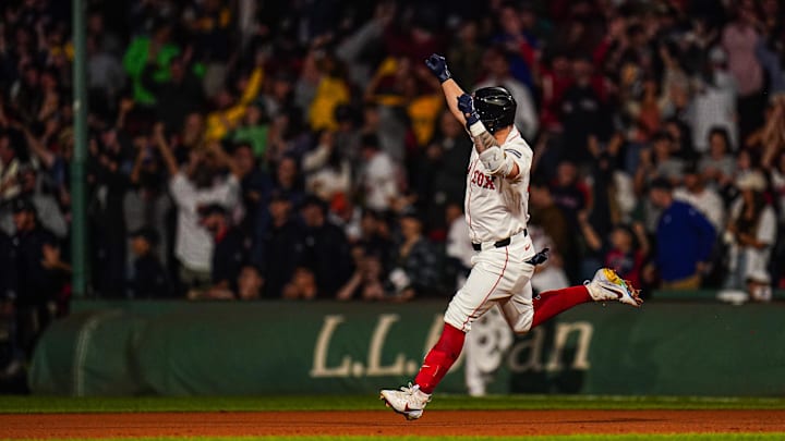 Sep 11, 2024; Boston, Massachusetts, USA; Boston Red Sox left fielder Tyler O'Neill (17) his a three run home run to win the game against the Baltimore Orioles in 10 innings at Fenway Park.