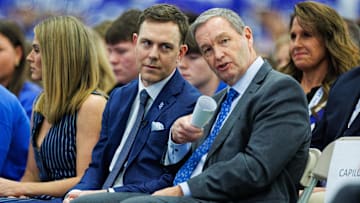 Dec 3, 2025; Lexington, KY, USA; Kentucky Wildcats athletic director Mitch Barnhart talks with head football coach Will Stein during his introductory press conference at Nutter Field House. Mandatory Credit: Jordan Prather-Imagn Images