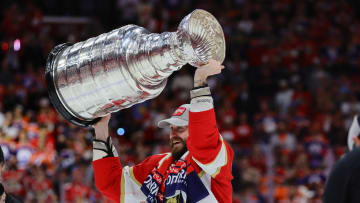 Jun 24, 2024; Sunrise, Florida, USA; Florida Panthers defenseman Oliver Ekman-Larsson (91) lifts the cup after winning game seven of the 2024 Stanley Cup Final against the Edmonton Oilers at Amerant Bank Arena. Mandatory Credit: Sam Navarro-USA TODAY Sports