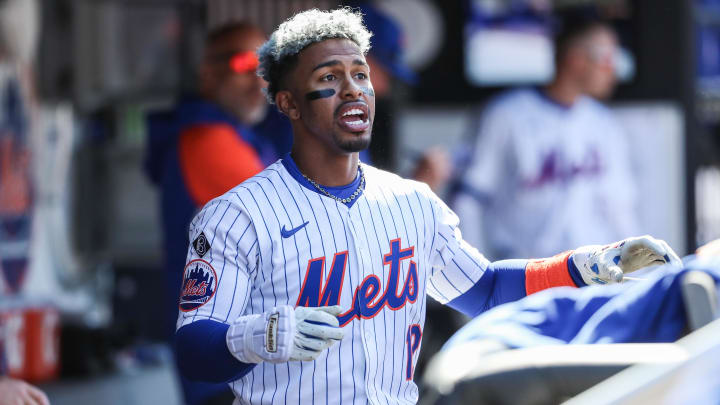Mar 31, 2024; New York City, New York, USA; New York Mets shortstop Francisco Lindor (12) talks with his teammates in between inning against the Milwaukee Brewers at Citi Field.
