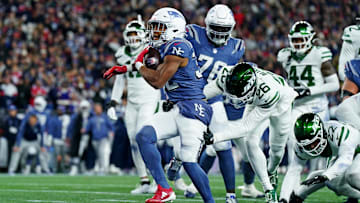 Nov 13, 2025; Foxborough, Massachusetts, USA; New England Patriots running back TreVeyon Henderson (32) celebrates after scoring a touchdown during the second half against the New York Jets at Gillette Stadium. Mandatory Credit: David Butler II-Imagn Images