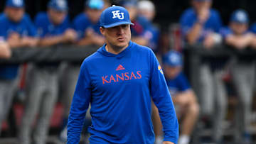 Kansas' head baseball coach Dan Fitzgerald walks to home plate during game two against Texas Tech, Friday, May 19, 2023, at Dan Law Field at Rip Griffin Park.