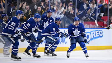 Apr 22, 2025; Toronto, Ontario, CAN;  Toronto Maple Leafs forward Max Domi (11) celebrates with team mates after scoring the winning goal in overtime against the Ottawa Senators in game two of the first round of the 2025 Stanley Cup Playoffs at Scotiabank Arena. Mandatory Credit: Dan Hamilton-Imagn Images