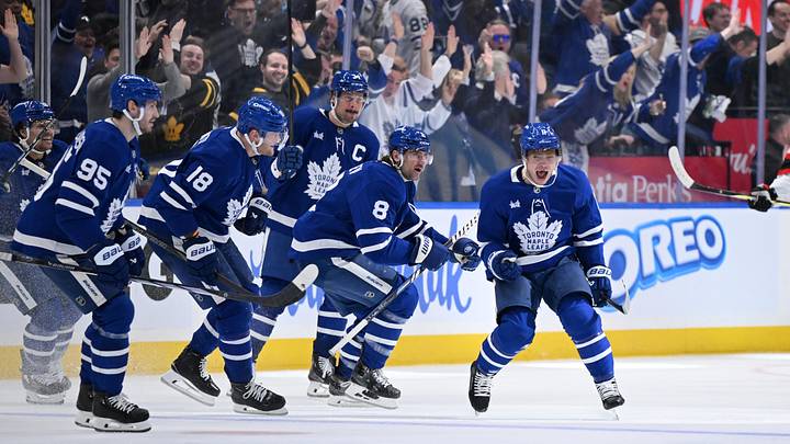 Apr 22, 2025; Toronto, Ontario, CAN;  Toronto Maple Leafs forward Max Domi (11) celebrates with team mates after scoring the winning goal in overtime against the Ottawa Senators in game two of the first round of the 2025 Stanley Cup Playoffs at Scotiabank Arena. Mandatory Credit: Dan Hamilton-Imagn Images