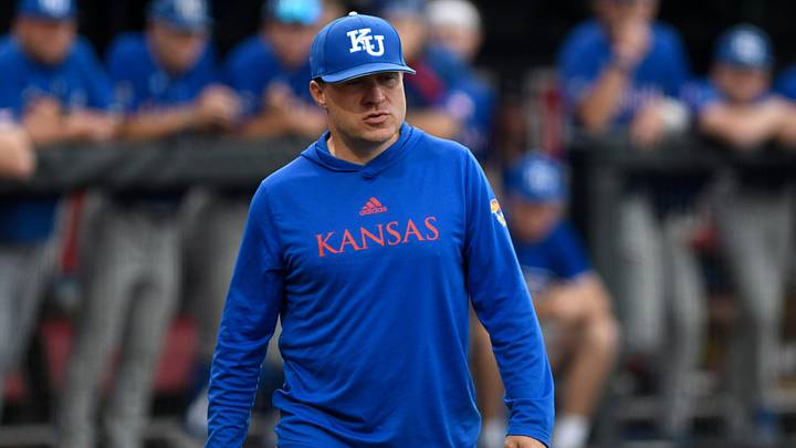 Kansas' head baseball coach Dan Fitzgerald walks to home plate during game two against the Texas Tech, Friday, May 19, 2023, at Dan Law Field at Rip Griffin Park.