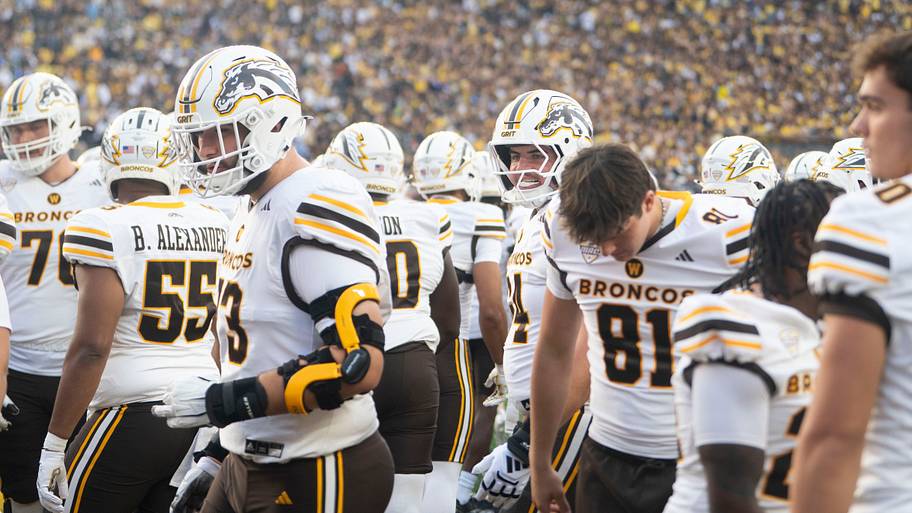 Western Michigan players on the sideline during the season-opening game at Michigan Stadium.